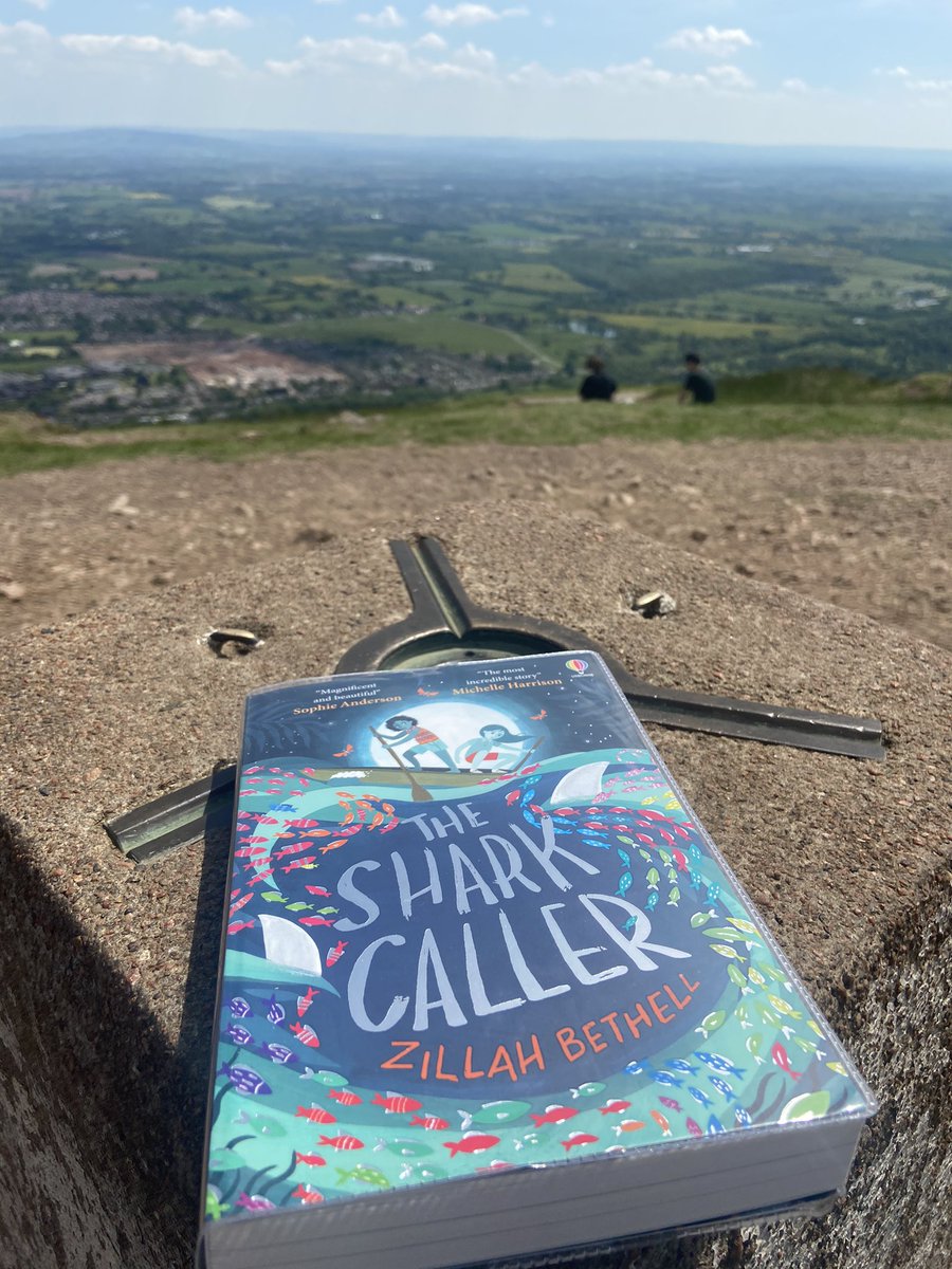 StBernsPrimary's tweet photo. Miss Hulse has stopped for a break at the top of the Malvern Hills to read The Shark Caller by @ZillahBethell #readingforpleasure #readingrolemodel #StaffBookClub #ExtraordinaryBook ⛰❤️ https://t.co/n5KxJijOWz