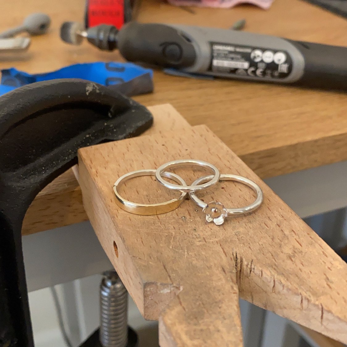 Today’s project - 3 rings!
Left - 9ct gold front with silver back
Middle - plain silver band
Right - silver band &amp; flower with 9ct gold centre

#northantshour #silversmithing #smallbusiness
