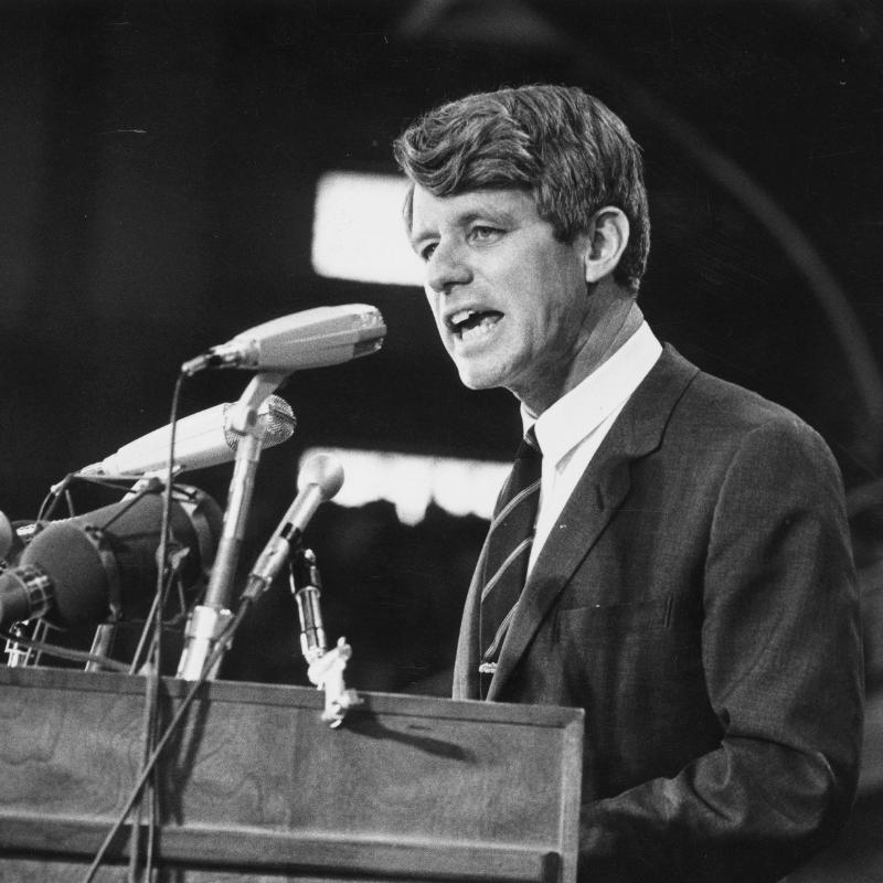 HISTORY's tweet photo. In the early hours in 1968 on #ThisDayInHistory, shortly after delivering a speech to celebrate his win in the California primary, Senator Robert Kennedy was shot outside the ballroom of the Ambassador Hotel. He died the next day.