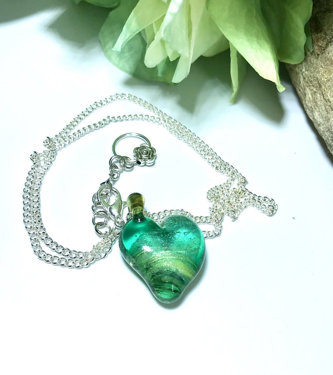 Visit emzglass.com: Teal glass heart pendant #glasspendant #lampwork #handmadejewelry #heartpendant #bohojewelry #beach #silvernecklace #tealpendant etsy.me/3iKARJE