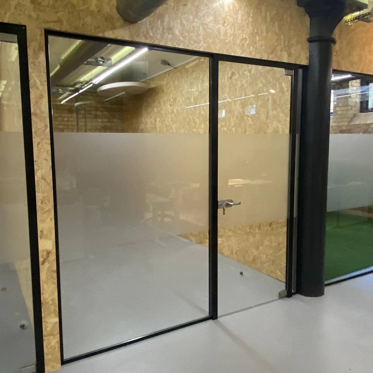 PremfixLondon's tweet photo. Industrial look offices installed at the Cargo Works, Blackfriars London. Consisting of plasterboard dividing partitions and dropped bulkhead, cladded with 18mm Sterling board for an industrial aesthetics. Complete with toughened glass &amp; black framework. #OfficePartition #fitout https://t.co/hjCrSgPz8O