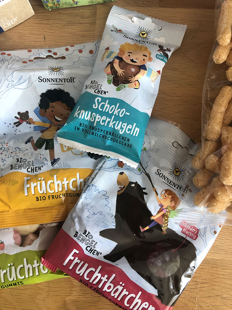 A very exciting box has arrived! Teas, hot chocolates, syrups, snacks and treats by @SONNENTOR and all covered in brand new packaging illustrated by #JezTuya for their children's range. Can't wait to try them out!