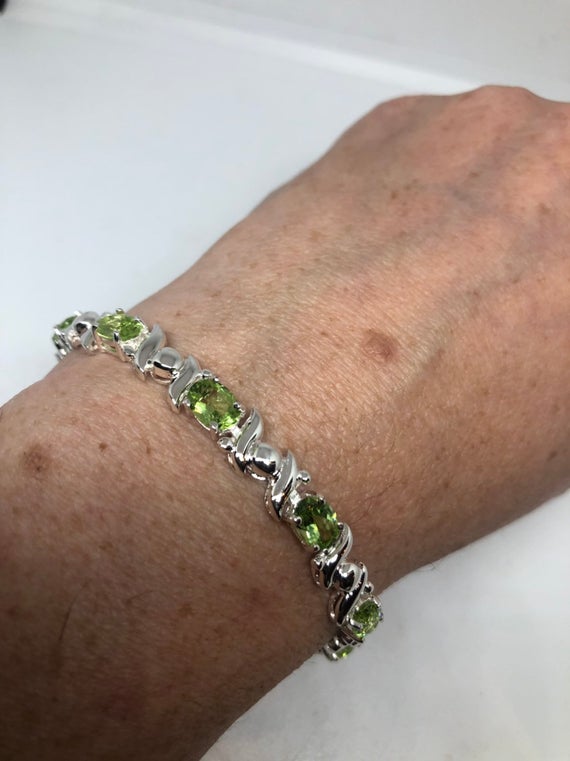 NemesisJeweryNY's tweet image. Vintage Handmade Genuine Peridot Rhodium Finished etsy.me/3vq37E5 #jewelry #bracelets #antiquesterling #gemstonebracelet @etsymktgtool
