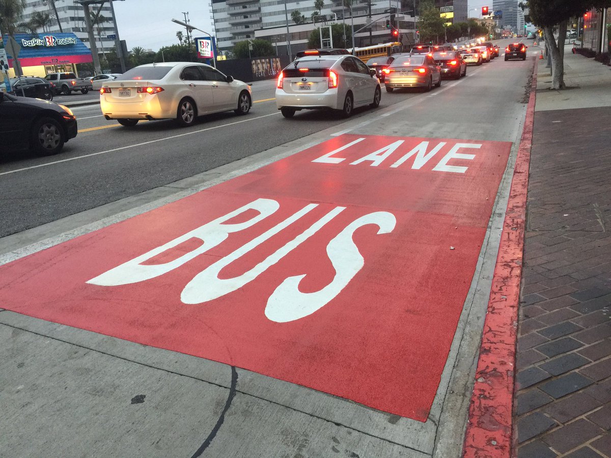 StreetsblogLA's tweet photo. New bright red bus lane markings - on Wilshire between the Westwood VA and Santa Monica. Thanks @LADOTofficial @LADOTlivable https://t.co/wazvOdTjn4