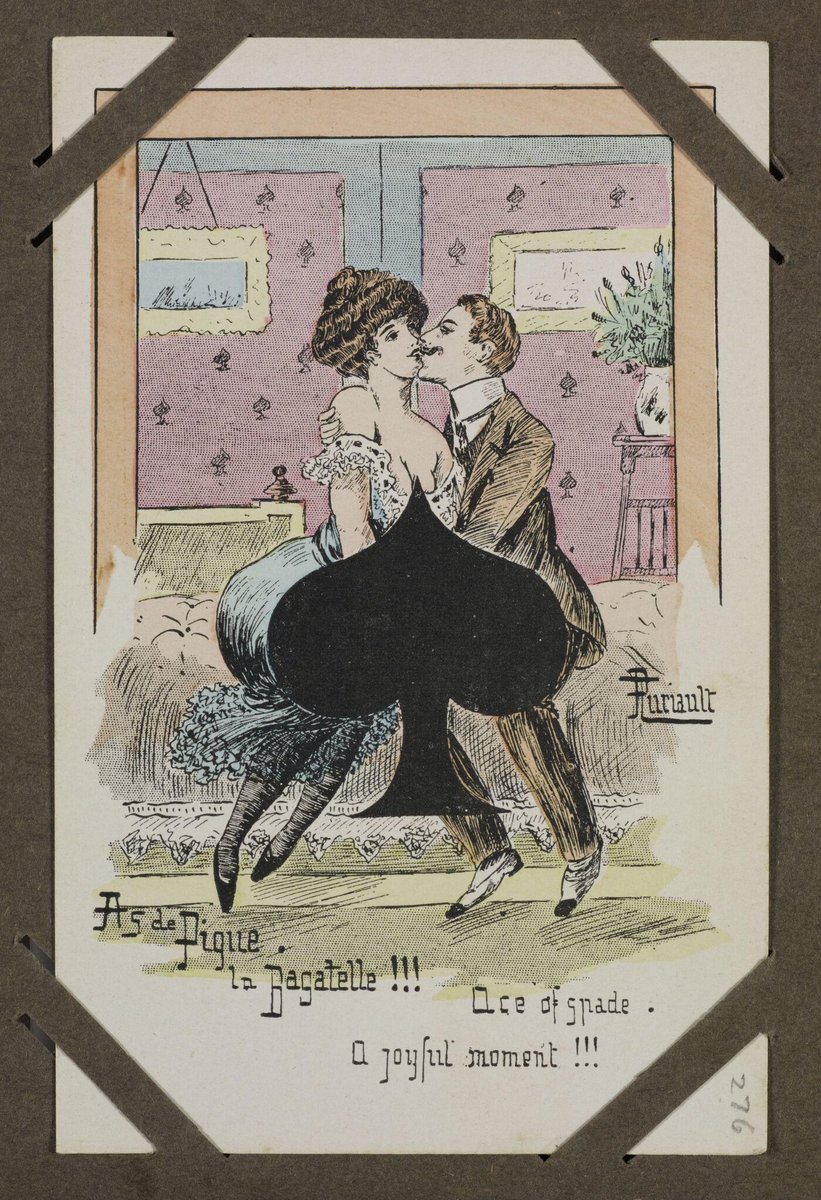 A postcard depicting a man and woman seated and kissing. What their hands are doing is concealed by a large ace of spades 