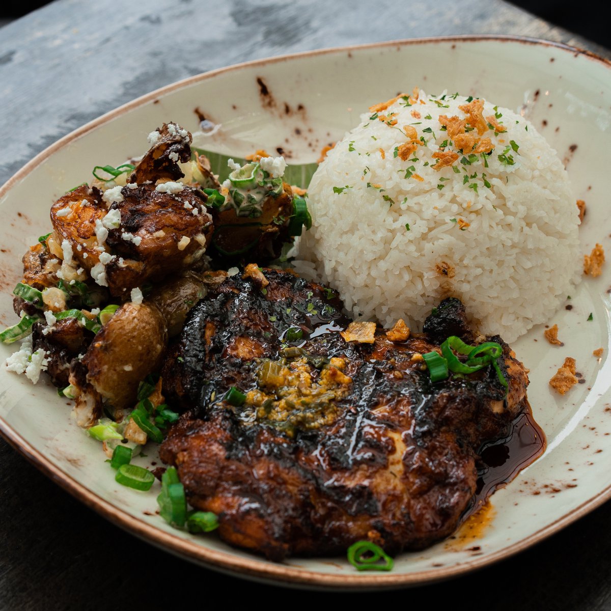 Easy to eat and bursting with flavours. 

Our chicken thigh inasal is a soy-glazed boneless chicken, served with jasmine garlic rice and fried potato salad.🥘 

A great meal to have on a friday