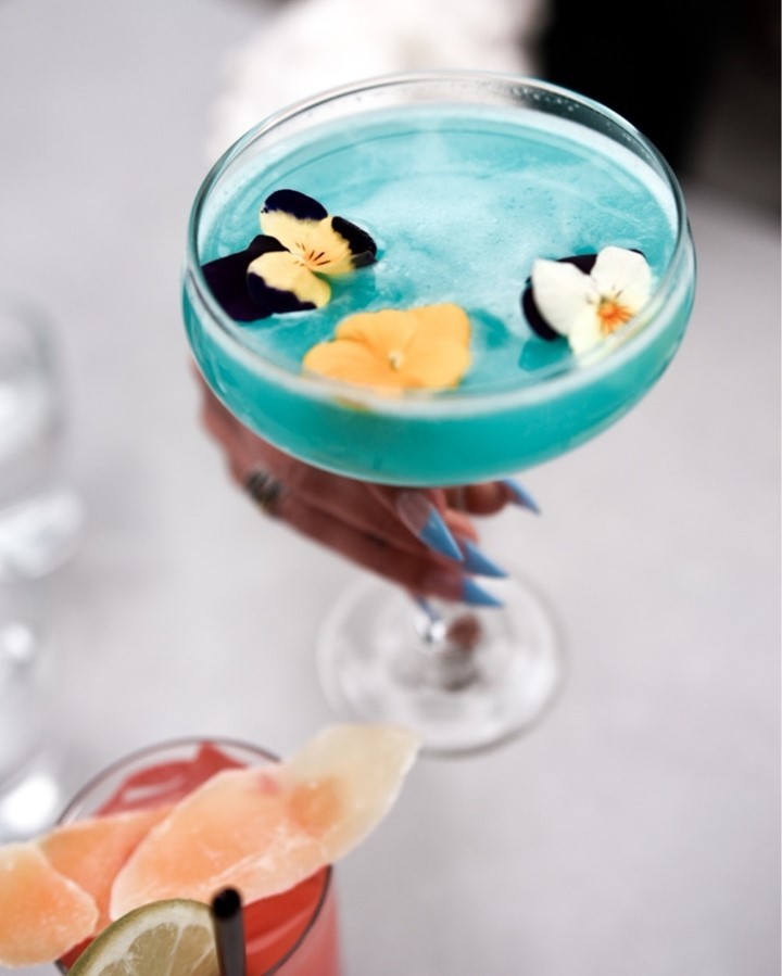 Everything's coming up flowers at <a href="/motifseattle/">Motif Seattle</a>'s Frolik Kitchen. Sip on this twist of a classic margarita, with lychee juice, and basil simple syrup. #DestinationByHyatt