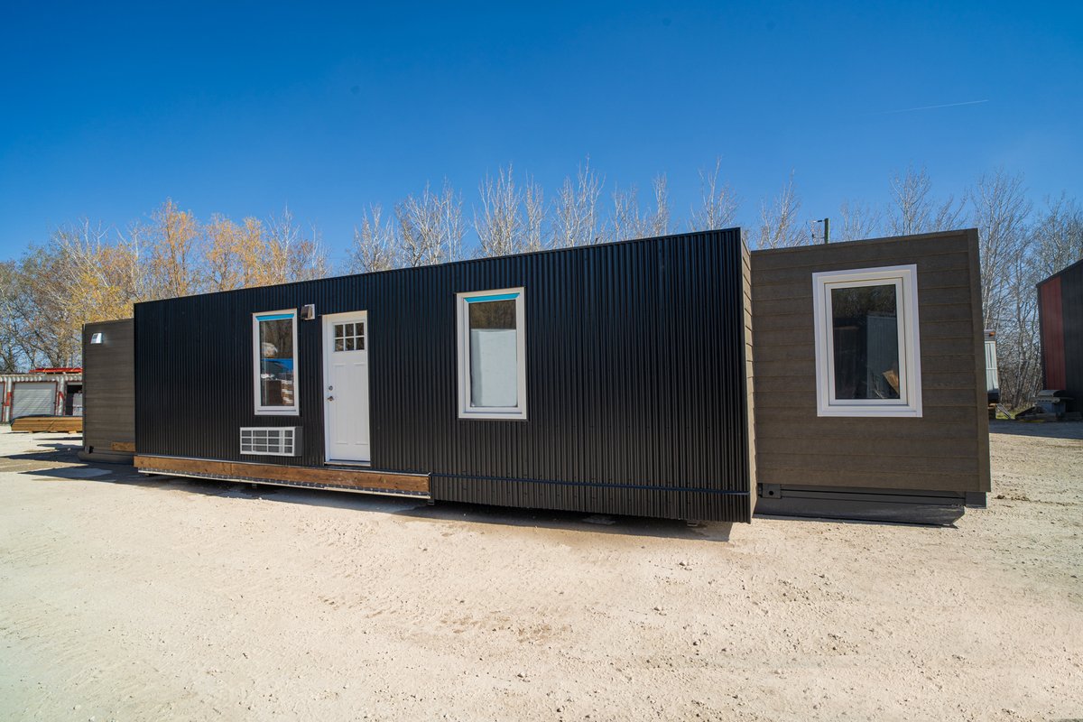 BisonModular's tweet photo. We offer several customized exterior finishes, such as a black 7/8” Corrugated panel siding. We recommend this product because of its lifetime use, durability in any climate, &amp; visual appearance!  ⁣
⁣
#BuiltBisonStrong #ContainerHomes  #ShippingContainerHomes #NorthernManitoba https://t.co/jLnktutyuL