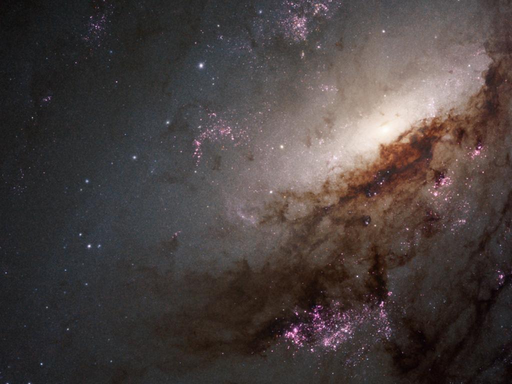 Image of spiral galaxy NGC 4258, which features a glowing supermassive black hole core