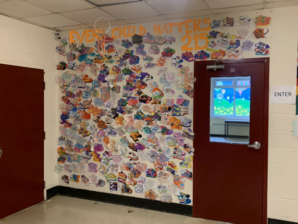noelleleedoyle's tweet photo. Every Child Matters!  215 pairs of sneakers to represent the little children found in an old Residential School this week.  SJB stands with you.  We see you. We hear you.  We will not forget.  @sjboscoschool @NLESDCA 

#residentialschools #everychildmatters #OrangeShirtDay https://t.co/v2wg4fqePn