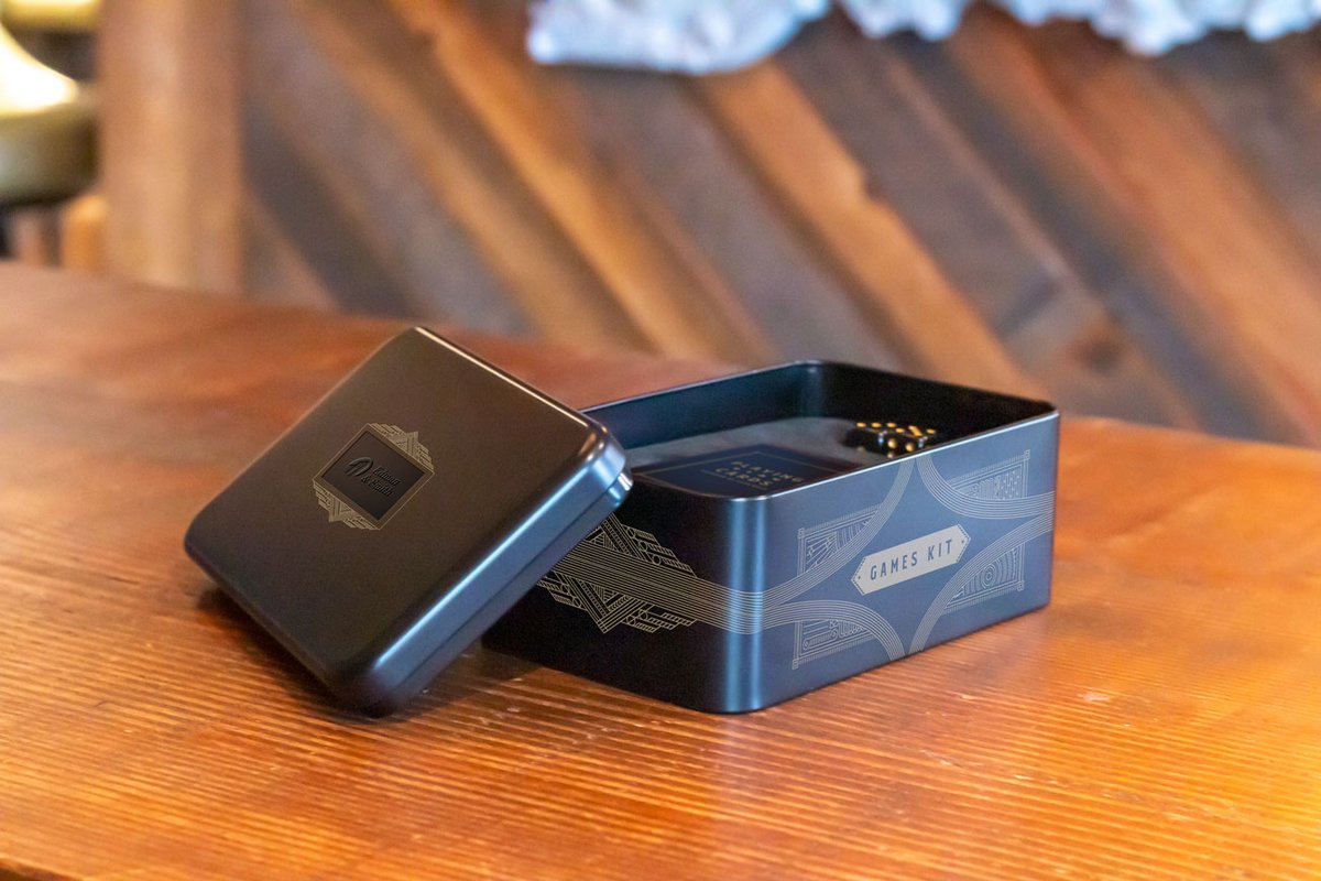 Pass the time with our portable games kit! Included in this customizable gift tin are luxe dominoes, dice, and playing cards.