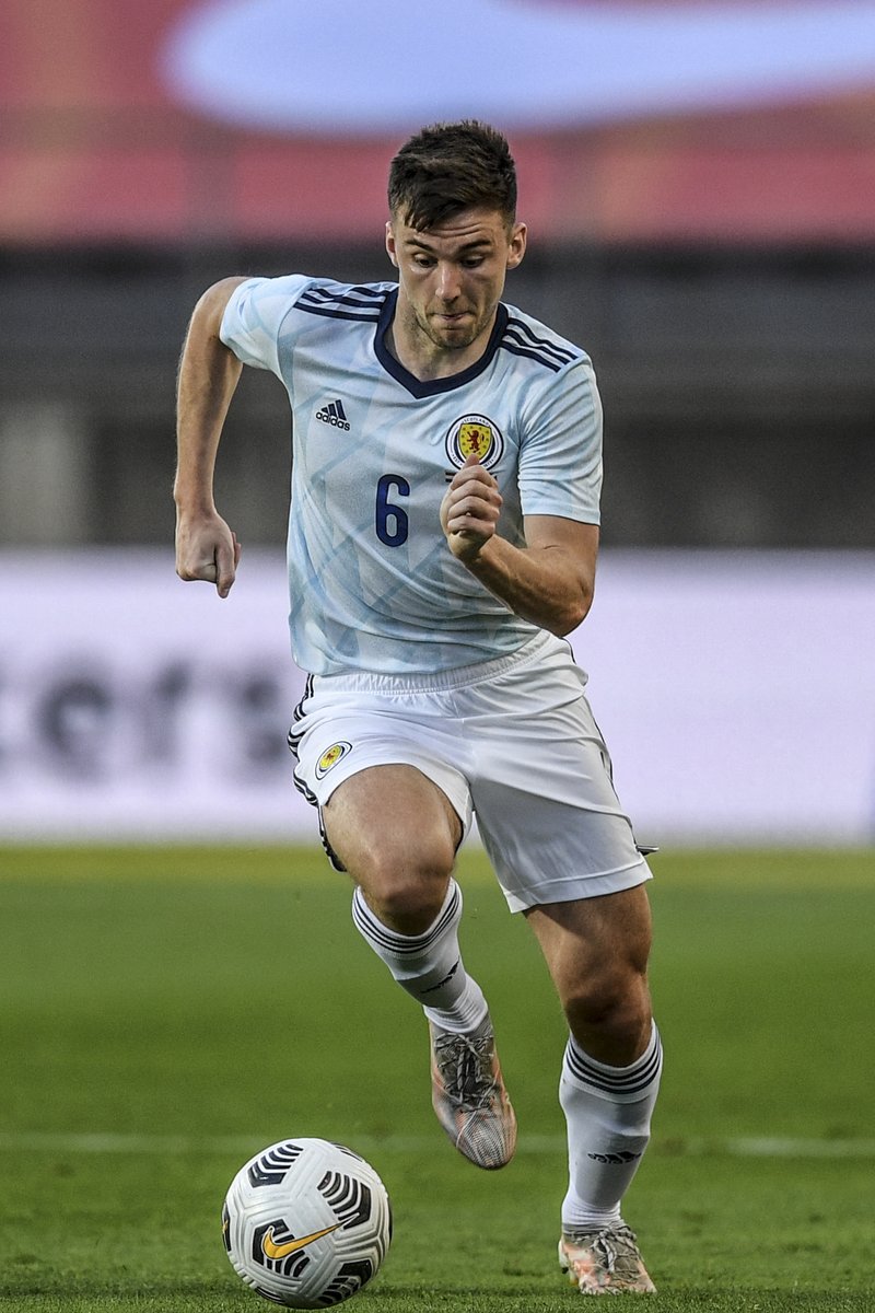 Kieran Tierney running with the ball on Scotland duty