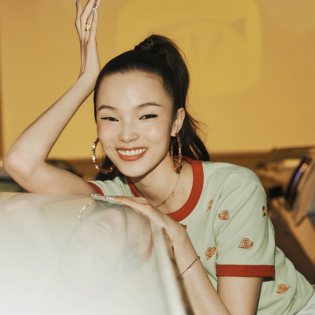 Coach's tweet photo. Front row guests (in four-wheel rides) at the #CoachShanghaiShow: actress #YangZi, singer #Oscar, model #XiaoWenJu and actor #WallaceChung. #COACH秀场直击 #CoachNY https://t.co/fskykELMTH
