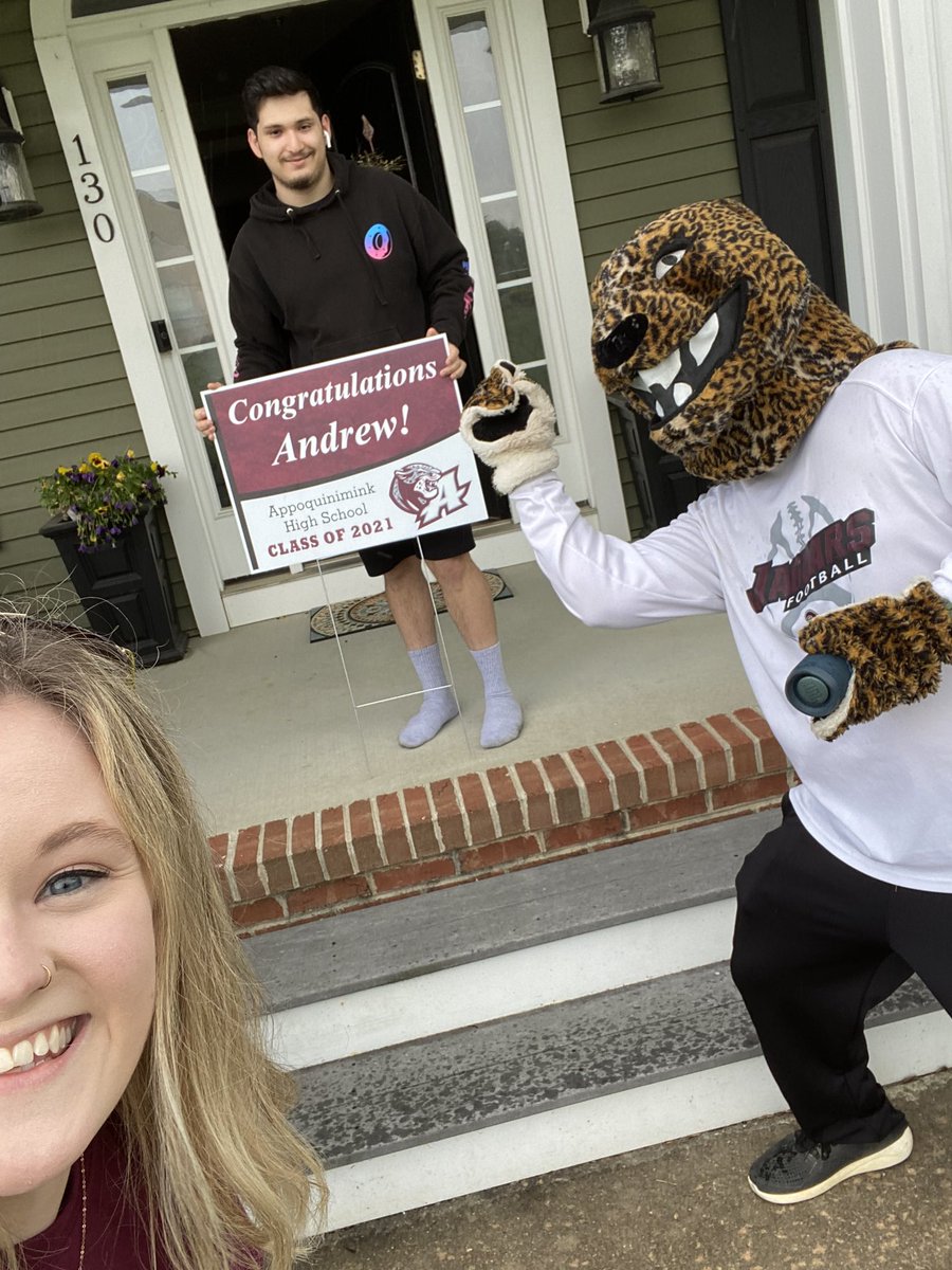 MrsCoumatos's tweet photo. We may have gotten rained on a little today but it was worth it! Congrats #Classof2021 🎉🎓 #AppoPride (missed a couple of kiddos so their signs helped us with our selfies) https://t.co/UbLt1mtjM2