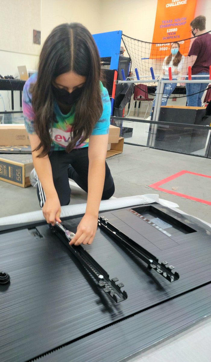Sharylandrobots's tweet photo. Andrea from @TechSerpents putting together a big screen TV cart for @voltage12397 workspace... https://t.co/i2UAHSJkn8