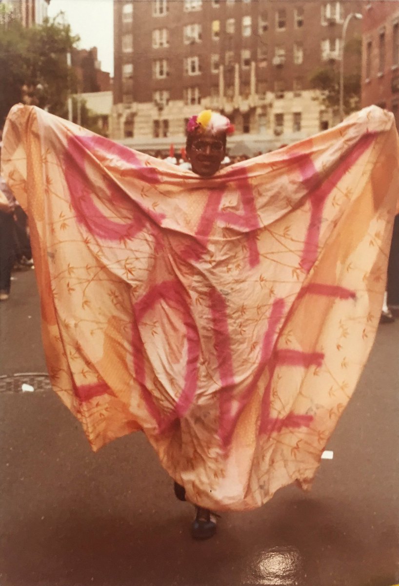 BlackTransConn1's tweet photo. Marsha P. Johnson holding fabric with words "Gay Love," 1980 https://t.co/uxgU4PEalf