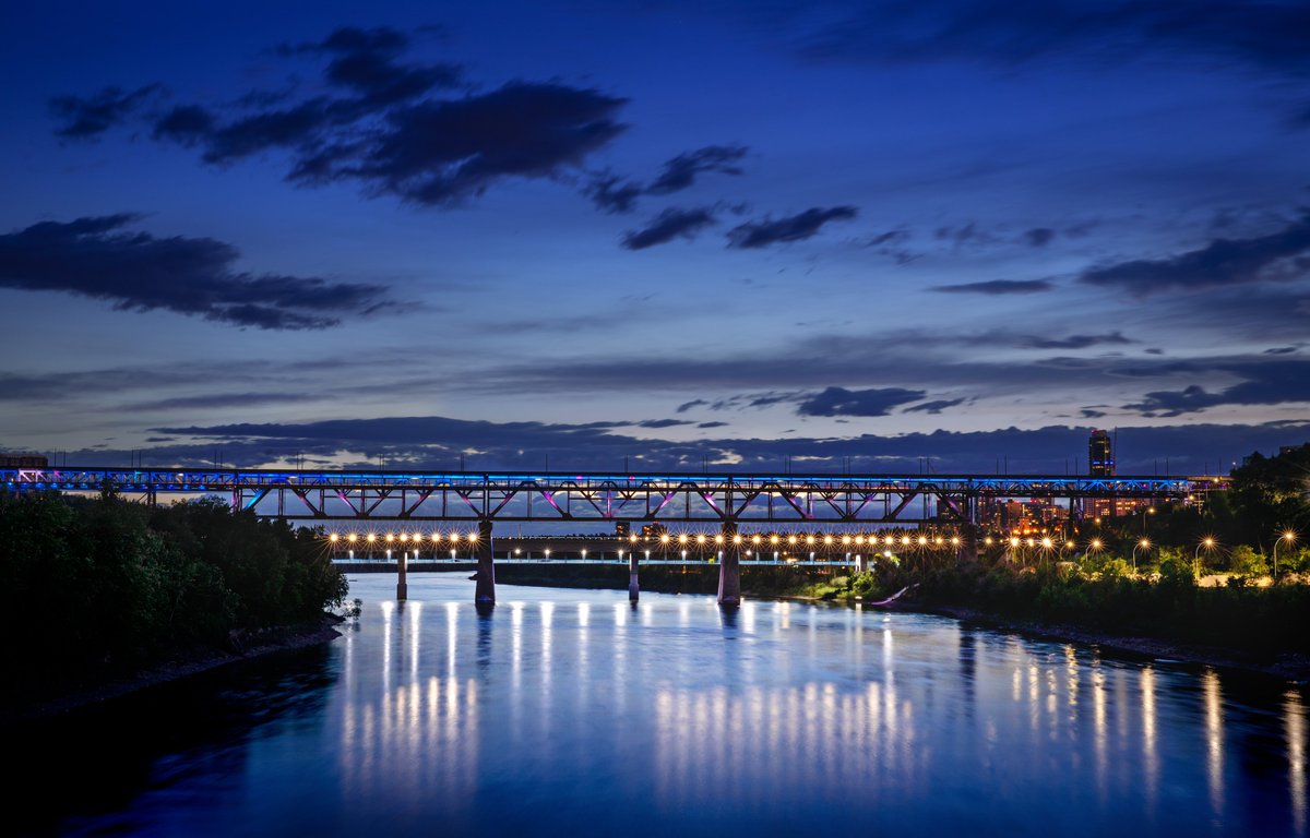 NAIT's tweet photo. Loved seeing the High Level bridge lit up in NAIT colours. Hope you all have a great convocation day! #NAITGrad #Ookforlife https://t.co/BeMaxXHrEr