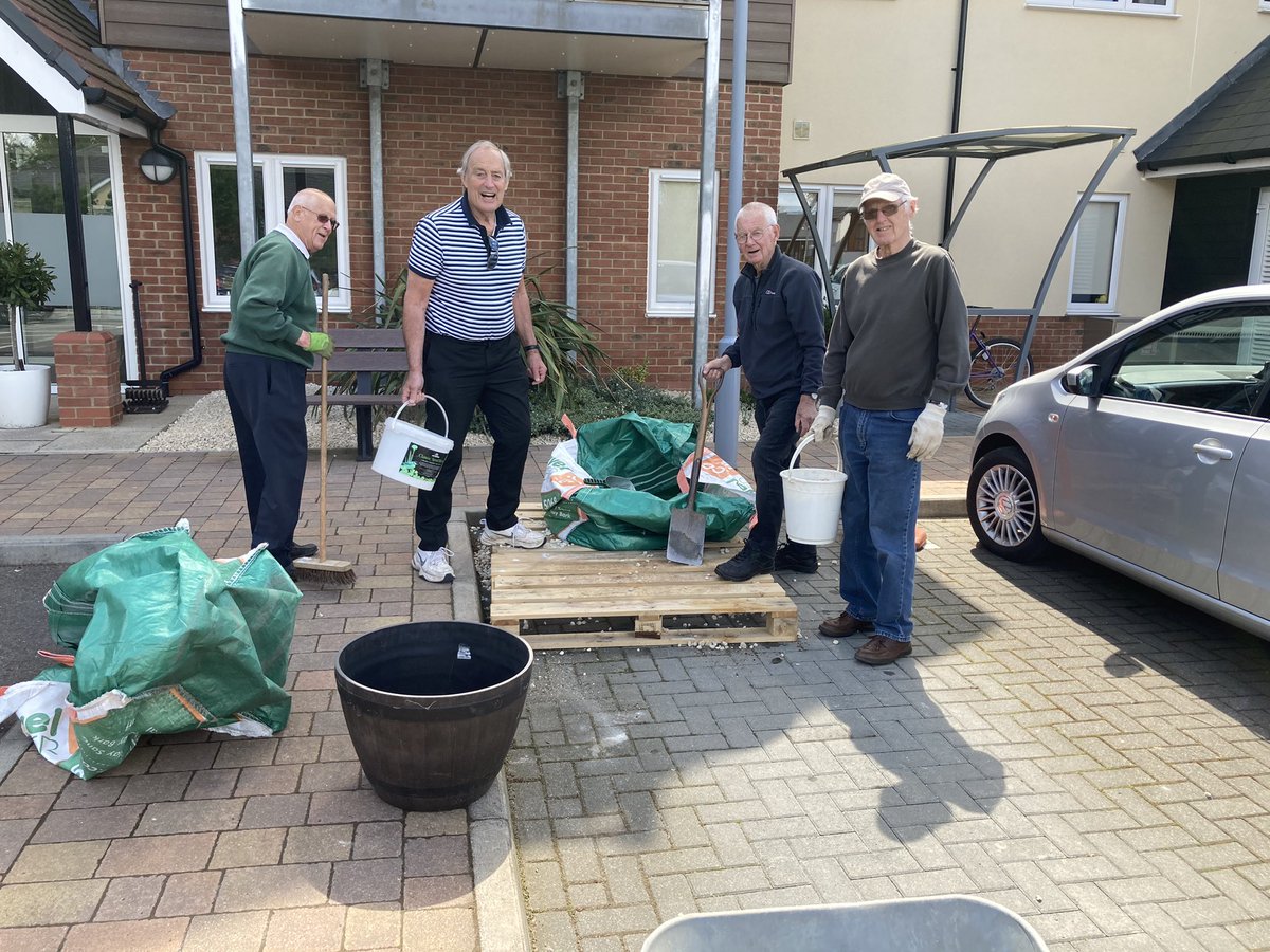 Resident volunteers working hard to create a real “touch of class” to our front entrance.  Amazing what we can do when we all pull together.