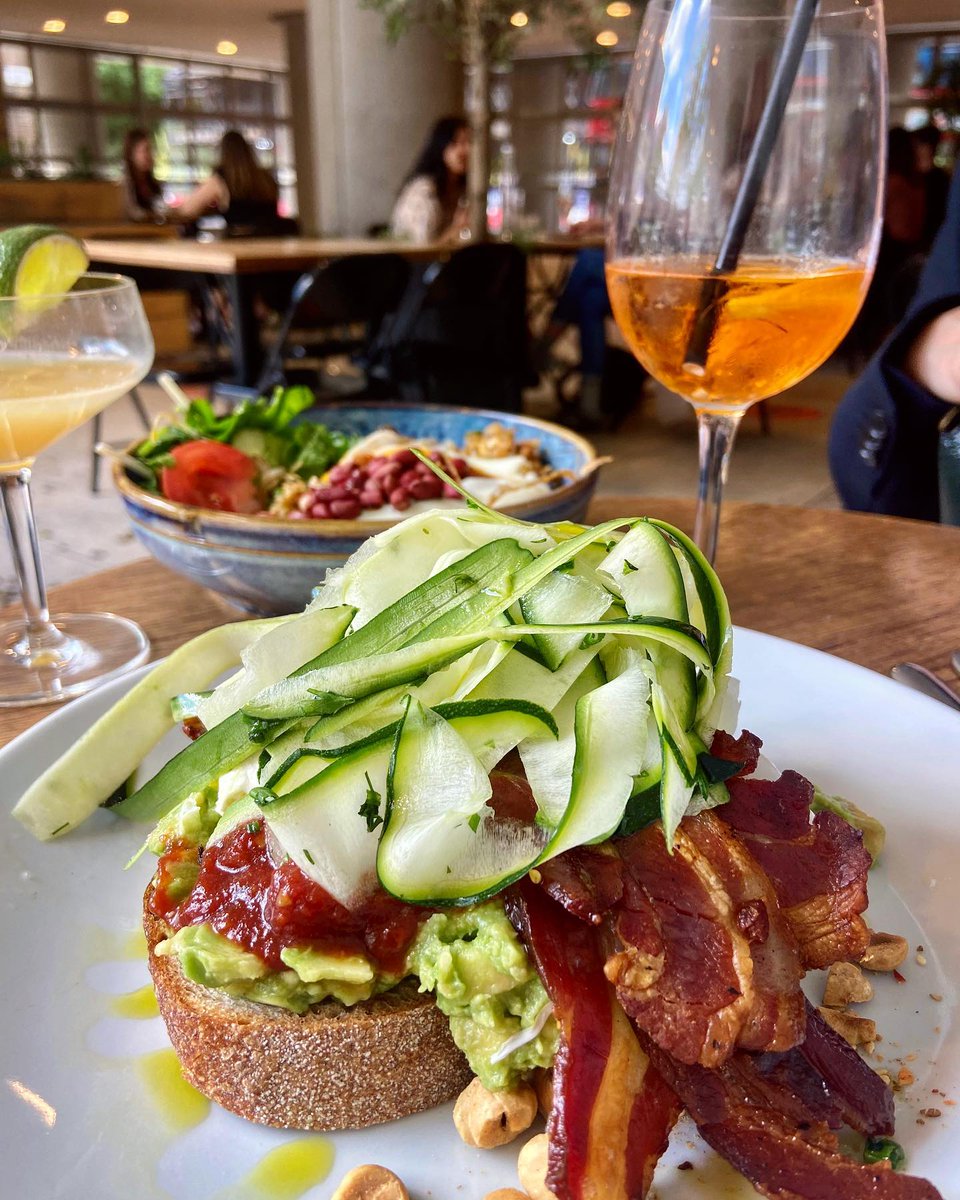 Eggcellent brunch at lantanacafe 😍😋 Smashed avocado &amp; bacon on sourdough with poached egg, chilli jam, labne, hazelnut &amp; pistachio dukkah, shaved raw courgette &amp; herb salad and Indonesian fried rice with shredded chicken (Nasi Goreng Lantana style with brown rice, chilli samb