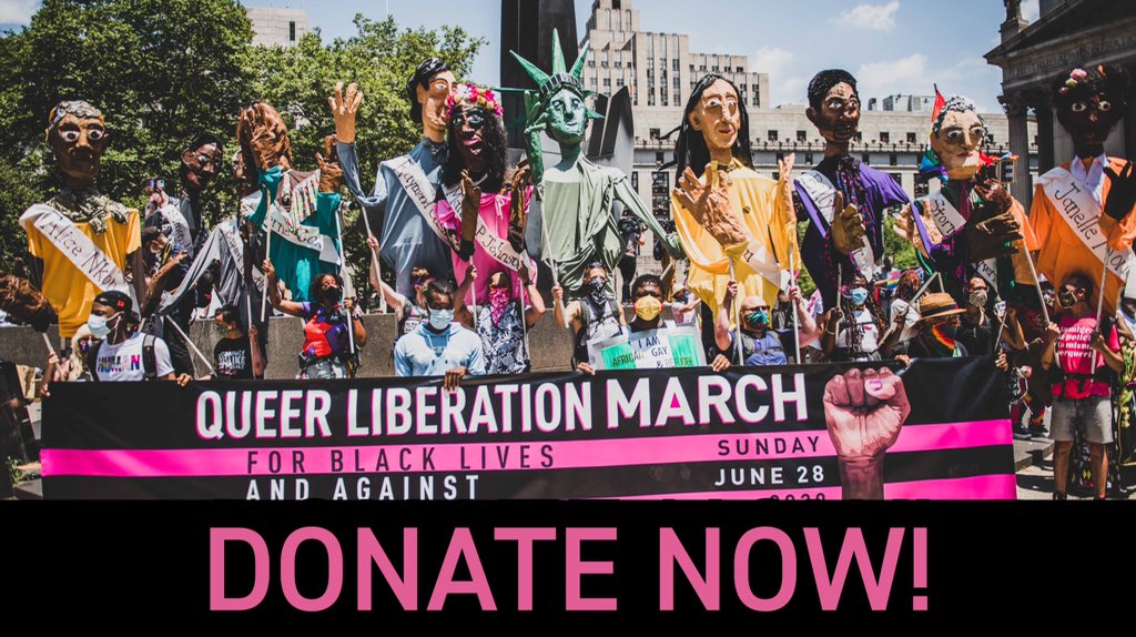In this photo, a group of people stand outside at a park. A group of masked people holds up a large black and pink banner that reads “QUEER LIBERATION MARCH FOR BLACK LIVES AND AGAINST POLICE BRUTALITY. Sunday June 28 2020.” On the right side of the banner is a black person’s fist, and the fist has pink nail polish. Behind the folks holding the banner, there is a row of massive puppets being held by volunteers. While not all puppets are visible in the image, a few of the puppets that can be seen fully represent Alice Nkom, Bayard Rustin, Marsha P. Johnson, the Statue of Liberty, and Sylvia Rivera.