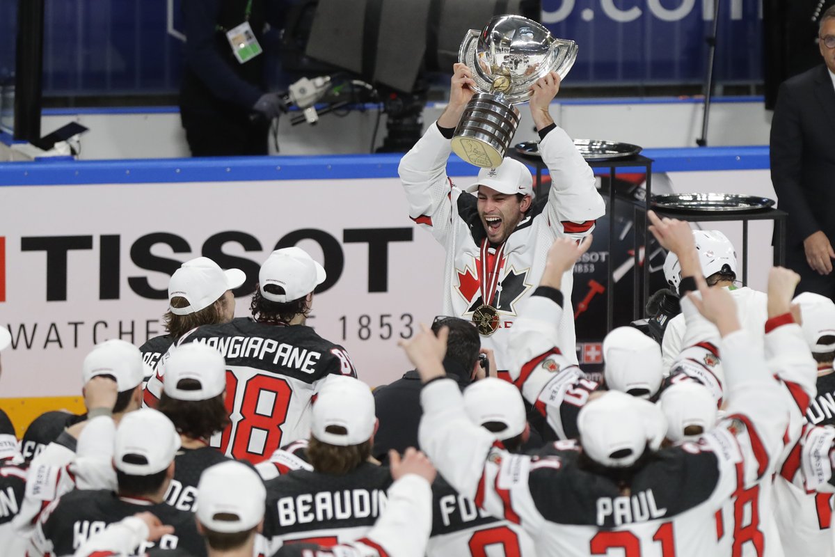 Team Canada lifts trophy at IIHF World Championships on June 6 after 3-2 overtime win against Finland 