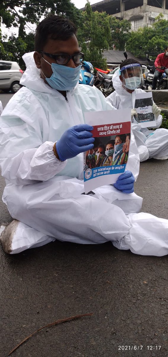 INCAssam's tweet photo. .@NSUIAssam President
@_KrishanuBaruah alongwith other NSUI activists staged a protest against SEBA/AHSEC exams wearing #PPE kits outside Jorhat DC Office. They have submitted a memorandum to the officials demanding to #CancelAsssamBoardExams amid COVID-19. https://t.co/UeGUITYK74