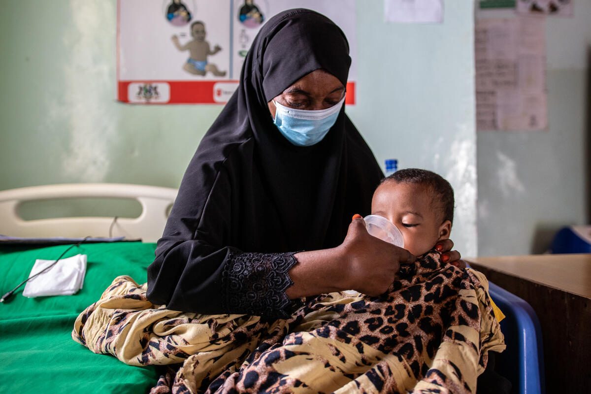 Zainab*, 7-months-old, being fed therapeutic milks by his mother in one of Save the Children's malnutrition treatment centres.