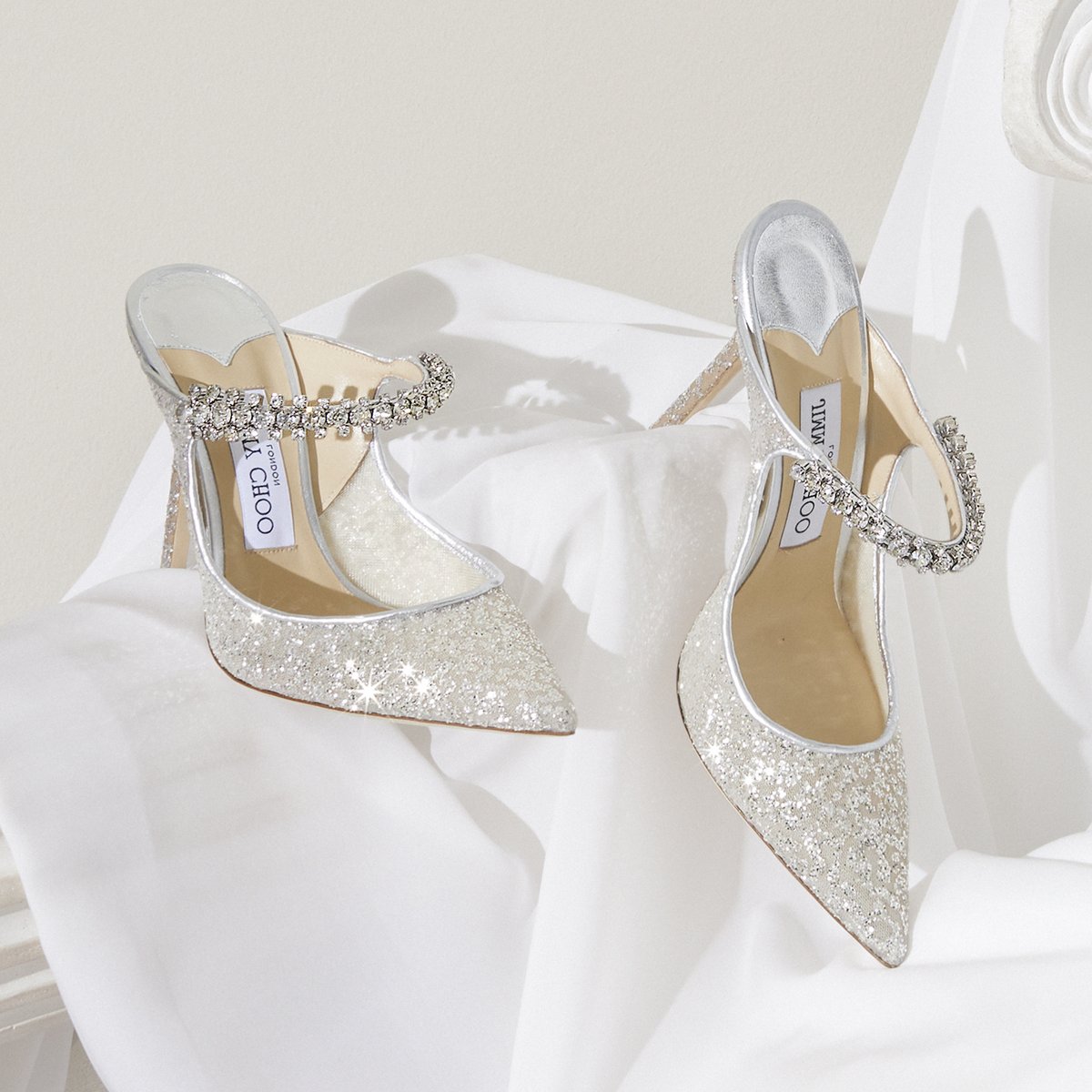 The BING mules get a bridal makeover in silver tulle with signature crystal strap #IDOINCHOO #JimmyChoo 

bit.ly/BRIDAL_JC_