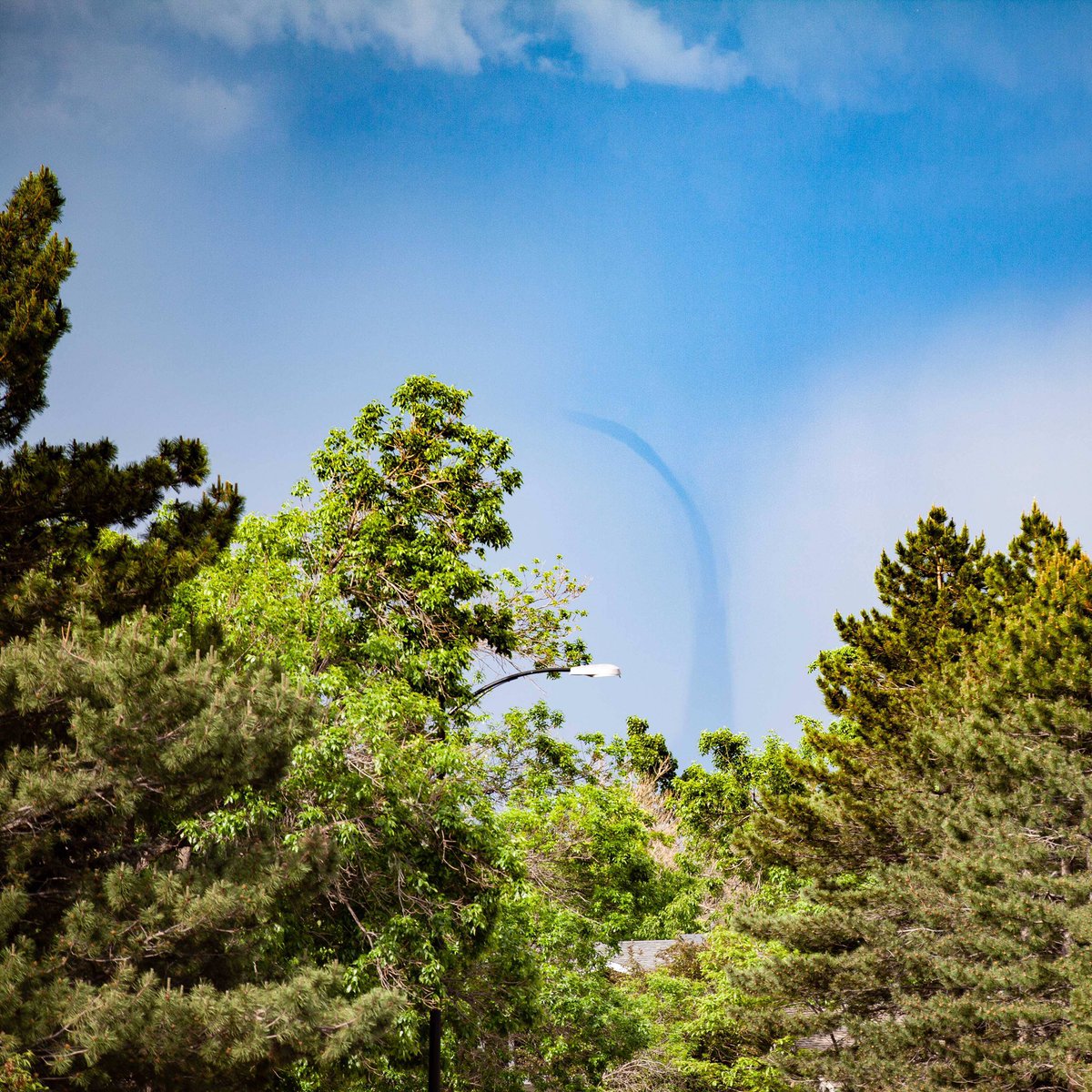 Funnel cloud visible down the street in #Boulder this afternoon. A friend called and told me to grab my camera. #cowx