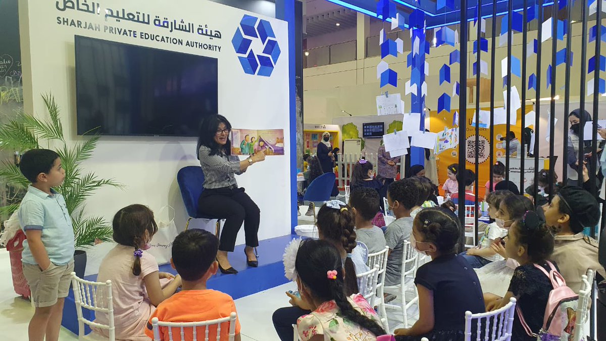 AIS_SchLibrary's tweet photo. Our very vibrant school librarian, Ms. Nawal, reading an Arabic book to a group of young readers at the Sharjah Children's Reading Festival. هيئة الشارقة للتعليم الخاص @SharjahBookAuth  
#AISSchLibrary #AISReading #AISCommunity https://t.co/JzRtSDZz9g