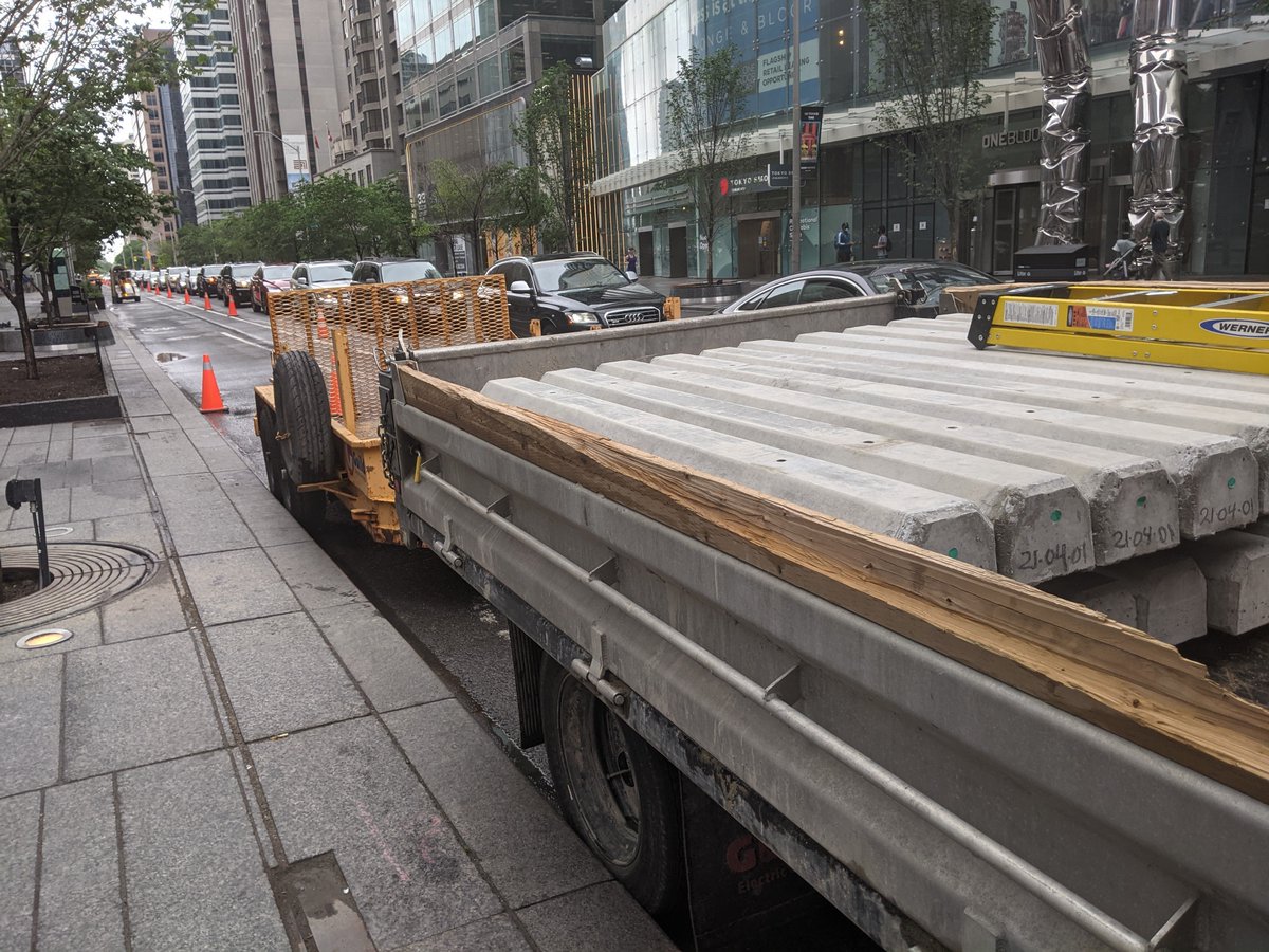 CycleToronto's tweet photo. The temporary #ActiveTO bike lanes on Bloor (Avenue-Church) have been realigned with parking protection. Concrete curbs and planters are on the scene. Crews are out today: keep an eye out for closure of lanes.
Want it permanent? 📝Sign #KeepActiveTO: https://t.co/aP9bOwoVkk https://t.co/AJ6tybRK8K