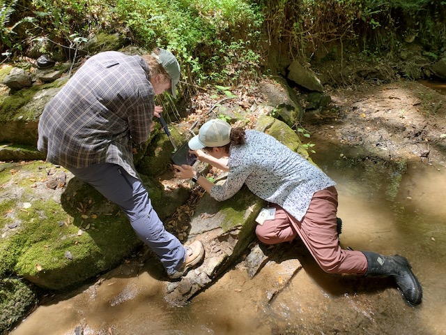 VAGEOL's tweet image. It is currently field season for our geologists! Here DGMR geologists examine and measure the Dover High Strain Zone in Goochland County. This mapping is supported by a #USGS #STATEMAP grant. Learn more here: tinyurl.com/pp3bpa4