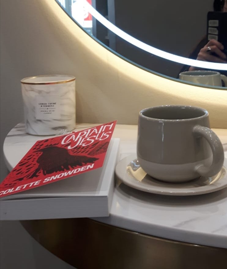 colette_snowden's tweet photo. Sent to me this afternoon: a picture of Captain Jesus at the hairdressers. A book and a brew is the perfect accompaniment to a hair cut. #CaptainJesus https://t.co/uKIe7MR3vQ