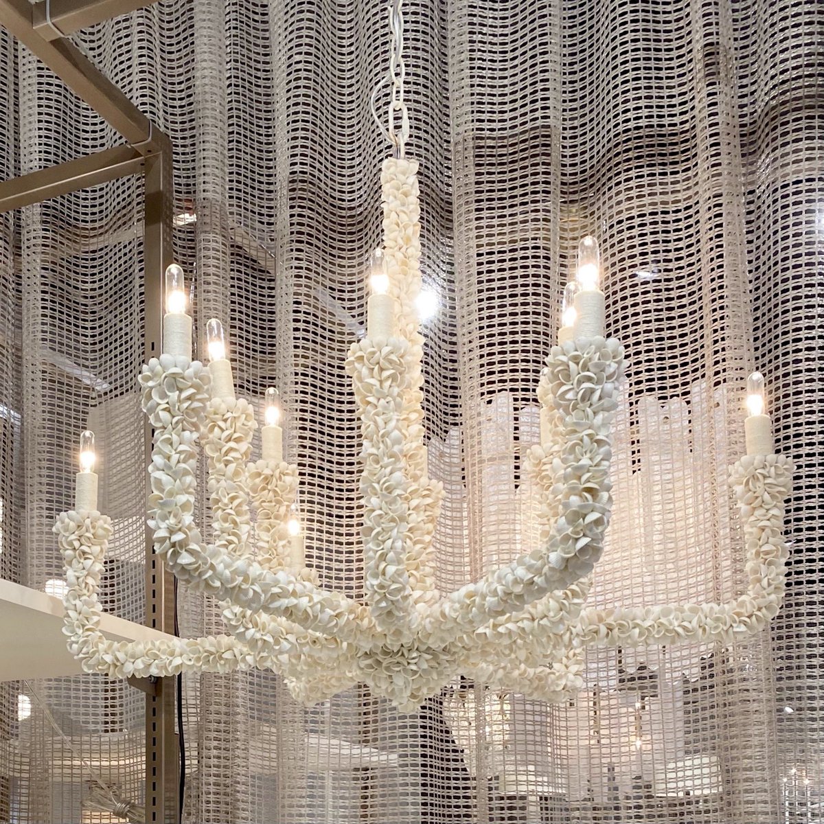 A traditional armed chandelier is updated with mixed materials to create the completely coastal Isle Chandelier from <a href="/arteriorshome/">Arteriors</a>. Maximize the design's potential and prominently showcase this chandelier at a beach or coastal home! #ClaytonGrayHome