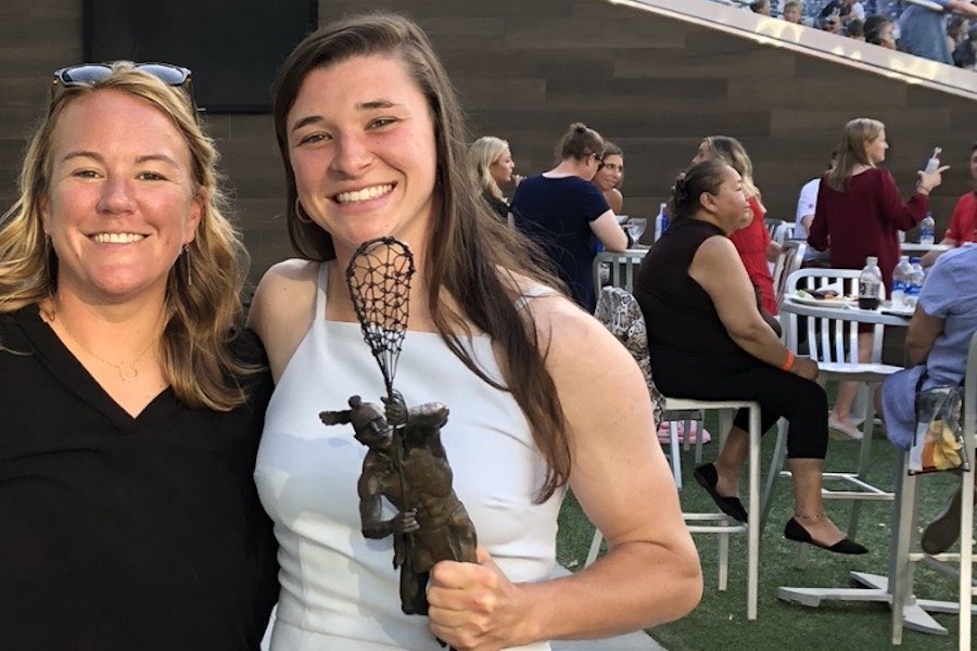ILWomen's tweet photo. After acting as an officiant in her former Syracuse player’s wedding, @PHLMaggie hopped on a red-eye to watch her high school player hoist the @Tewaaraton trophy. 

cc: 
@Liz_Hogan02 
@charlotteocho8

'An Unforgettable 24 Hours,' story: https://t.co/VJWNiDIxcr https://t.co/HkOuO3ss7z