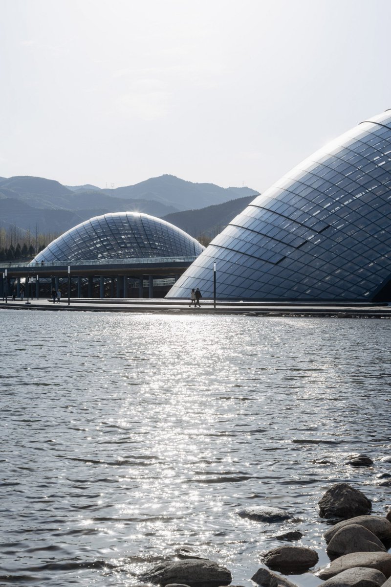 dezeen's tweet photo. Three giant domed greenhouses form the Taiyuan Botanical Garden: https://t.co/ujCvcxkH2M https://t.co/vzK7U47ILg