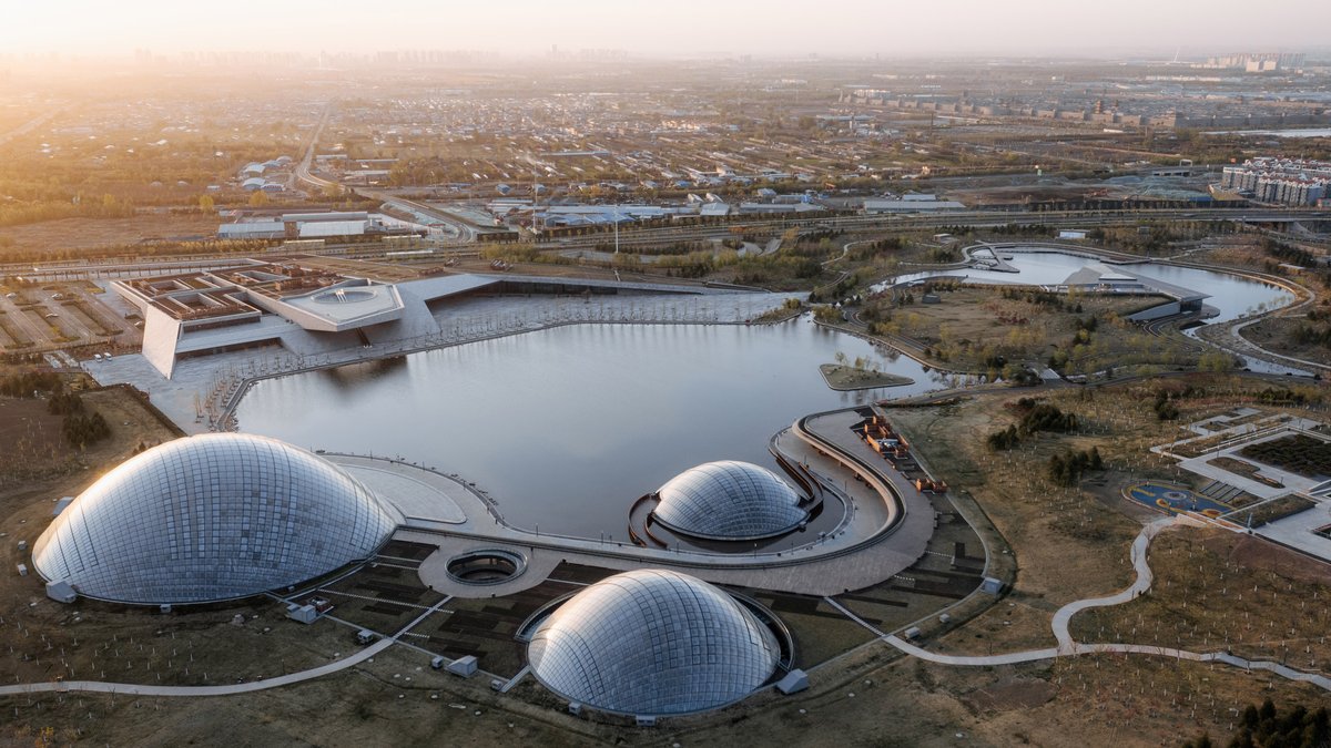 dezeen's tweet photo. Three giant domed greenhouses form the Taiyuan Botanical Garden: https://t.co/ujCvcxkH2M https://t.co/vzK7U47ILg