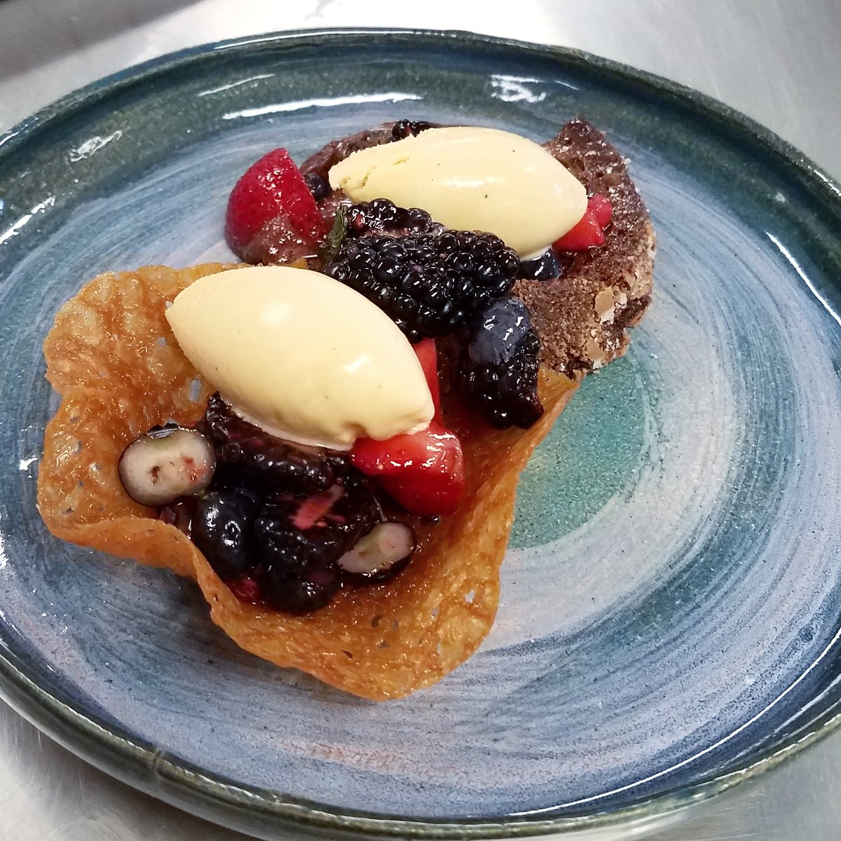 Molten Lava Cake, Brandysnap Tuile, Macerated Berries, Brown Butter/Salted Caramel Ice Cream. @TheRealHazenHS students made everything from scratch, using skills from all of #Baking and #Pastry class. The ceramic plate was also made by HHS students. Great #CTE collaboration!