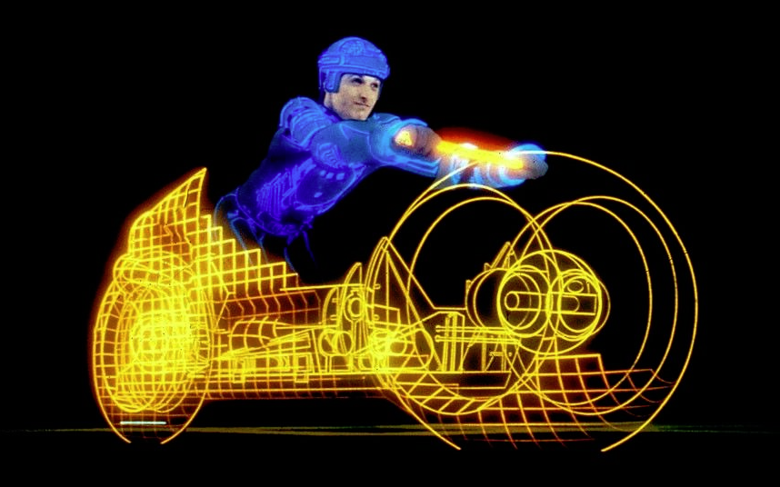 DrTomTilley's tweet photo. This is my son playing a first-person TRON lightcycle game back in 2007 using a controller made from some Ultraman motorcycle hand grips and PVC pipe.  The rear projection screen is just some Butchers Paper on a clothes drying rack.😁
  
#TRON #lightcycle #gaming #GLtron #PVC https://t.co/Qtpt6feUH3