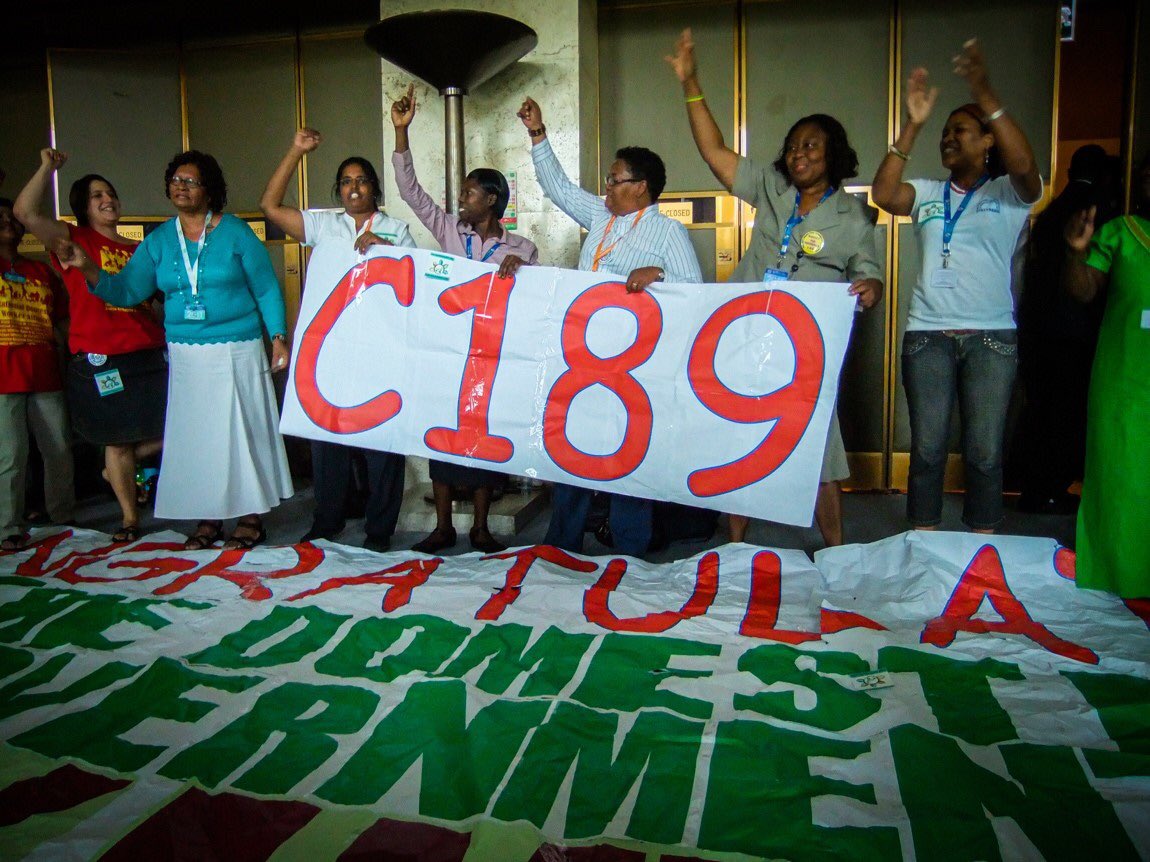 Domestic worker leaders chant, “Up, up domestic workers, down, down with slavery!” after the ILO vote to adopt the Domestic Workers Convention, June 16, 2011. © 2011 Jennifer Natalie Fish