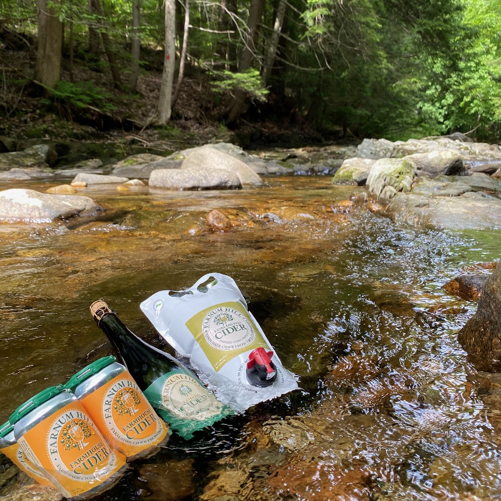 Stop sweltering - stick feet in bucket of cold water! Adorable brook not needed (@FarnumHillCider - cheers to cool tricks)! #cidertime #staycool