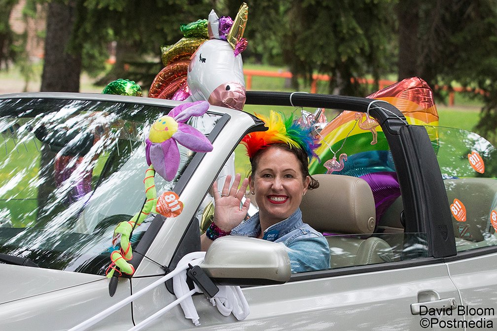 Participants in the Alberta Health Services (AHS) Edmonton Zone Pride Drive parade through the grounds at Alberta Hospital, in #yeg Wednesday. The parade visited 8 AHS facilities. #AHSprideDrive