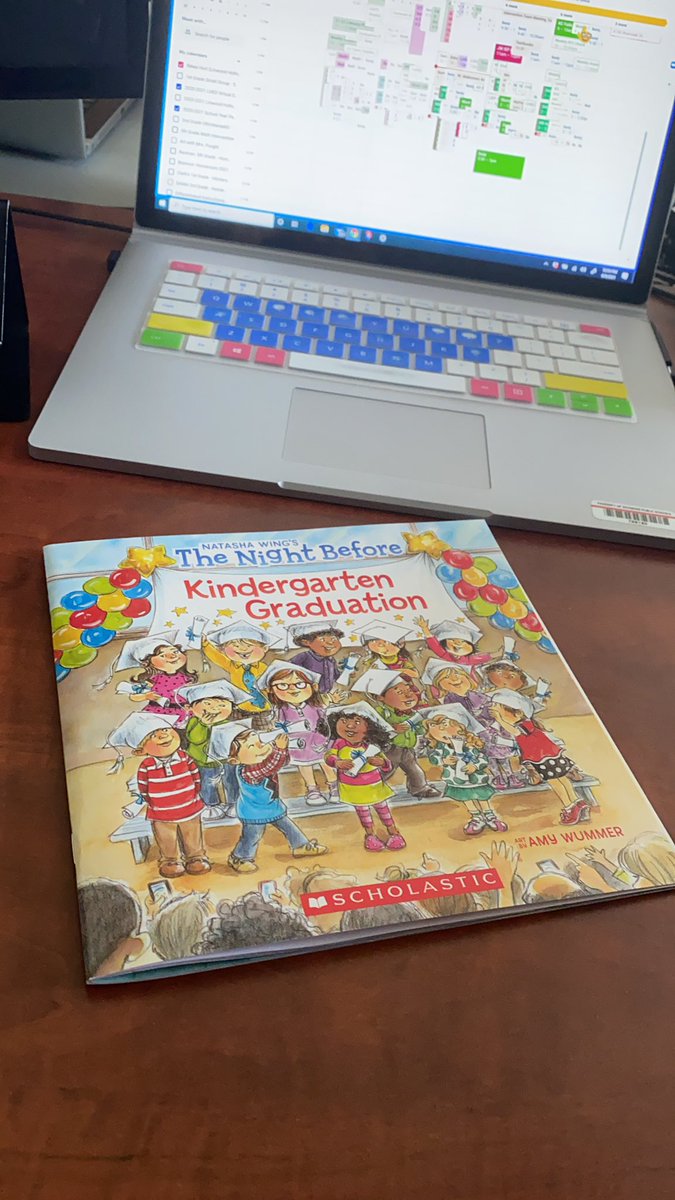 Signing books for each of our Kindergarten students!