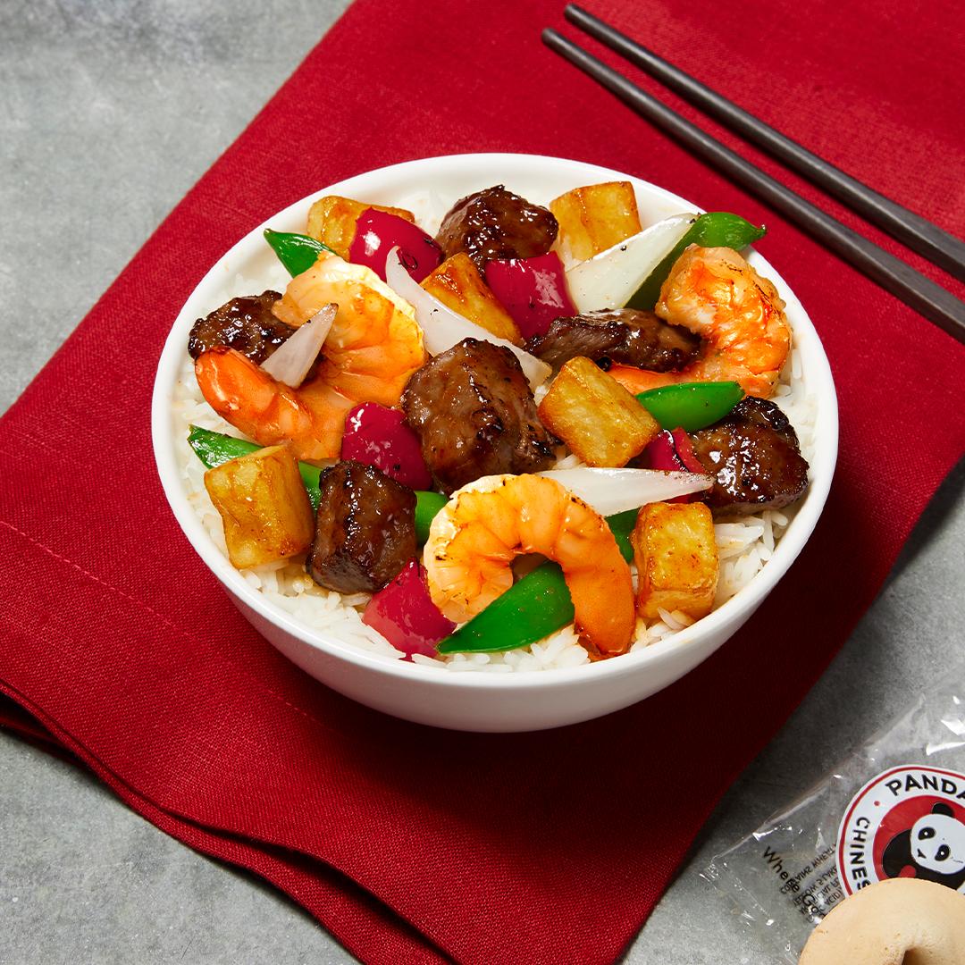 PandaExpress's tweet photo. Team Steak or Shrimp? Our new Wok-Seared Steak and Shrimp has it all! Angus sirloin steak & premium shrimp with sugar snap peas, red bell peppers, onions and crispy chunks of potatoes in a sweet and savory sauce. Only here for a limited time! #CraftedInFlames https://t.co/xlH4BAdljl