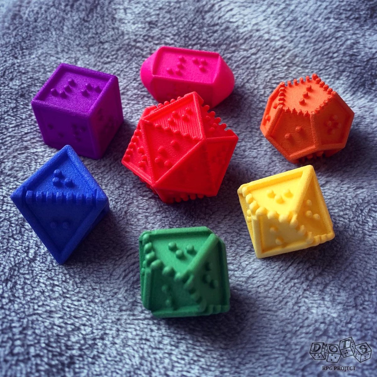 DOTSrpg's tweet image. Have a little #pride love from your friendly neighborhood LGBTQIA+ #AccessibilityInTabletop team, in #BrailleDice form! Our unique set of #dice helps make dice rolling #Accessible to #Blind and #VisuallyImpaired #dnd #TTRPG gamers thanks to the tactile #braille.