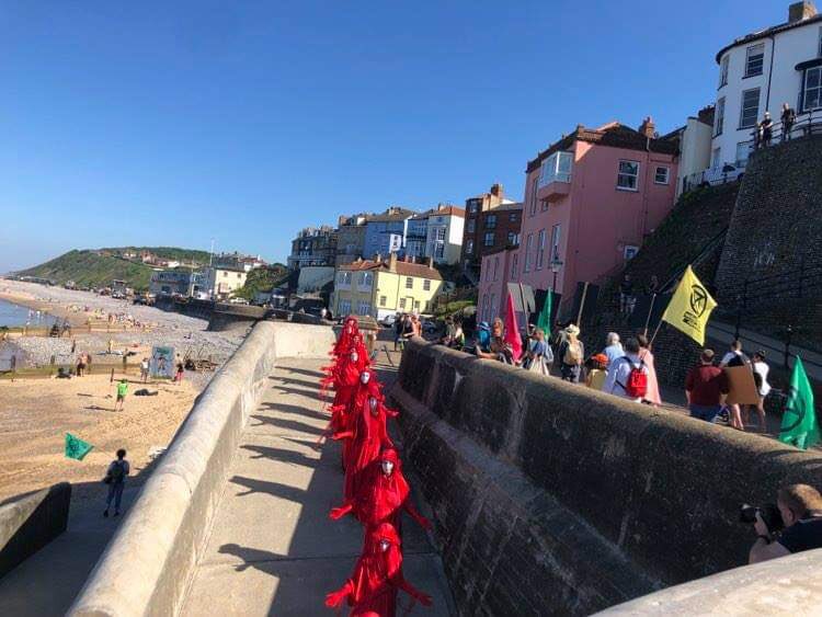 West Norfolk rebels joined Norwich and North Norfolk in Cromer today for “Make the Wave”, a nationally aligned action leading up to the G7 summit. Highlighting the flood risk, rebels head to coastal areas to reach out to locals and to put pressure on the G7 leaders to Act Now!