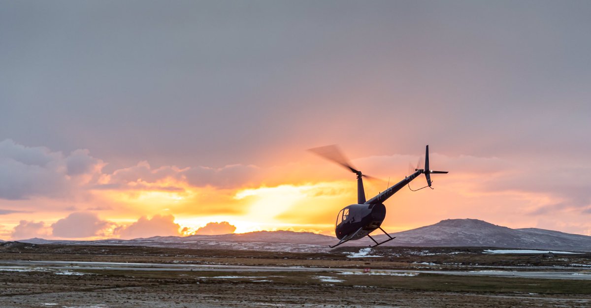 We love this photo that a customer took recently of our aircraft getting airborne at sunset. #falklands @Robinson_Heli