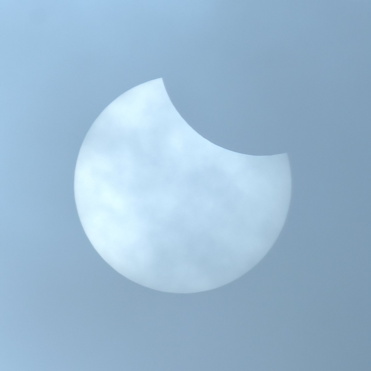 Solar eclipse now visible through heavy cloud here in Argyll, Scotland. Max (30% here) at 11.15am. Please be careful watching the sun solar filter required although the clouds were acting like a solar filter for me here in this image. #solareclipse #solareclipse2021 #scotland
