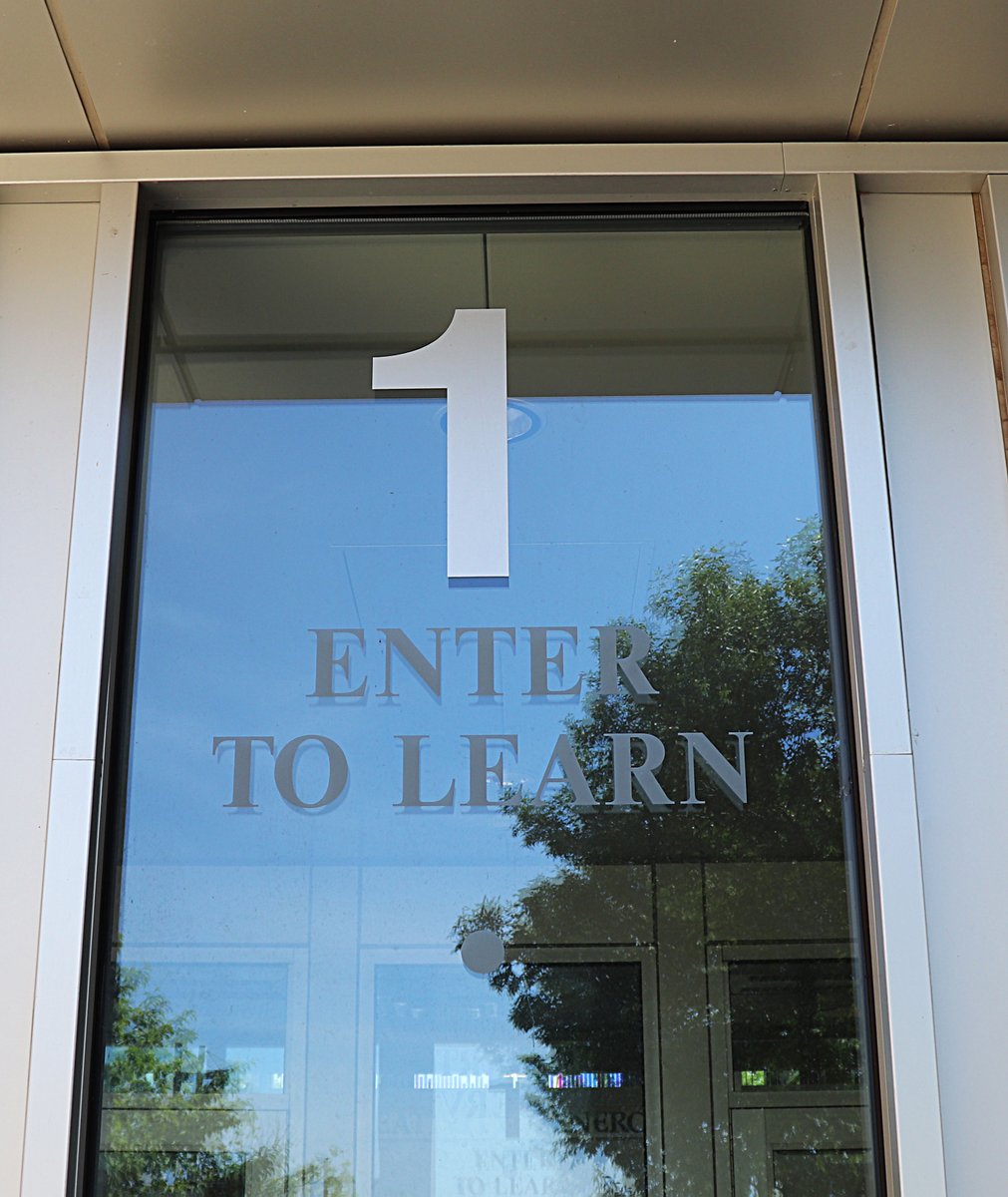 isd47's tweet photo. "Enter to learn, depart to serve." SRRHS students past and present have been inspired by these words. The originals are posted on Hillside's Adult Basic Education entrance/exit and a more recent version on the front doors of the current high school. #StormStrong #TBT #ThenAndNow https://t.co/aDgjD0NBKd