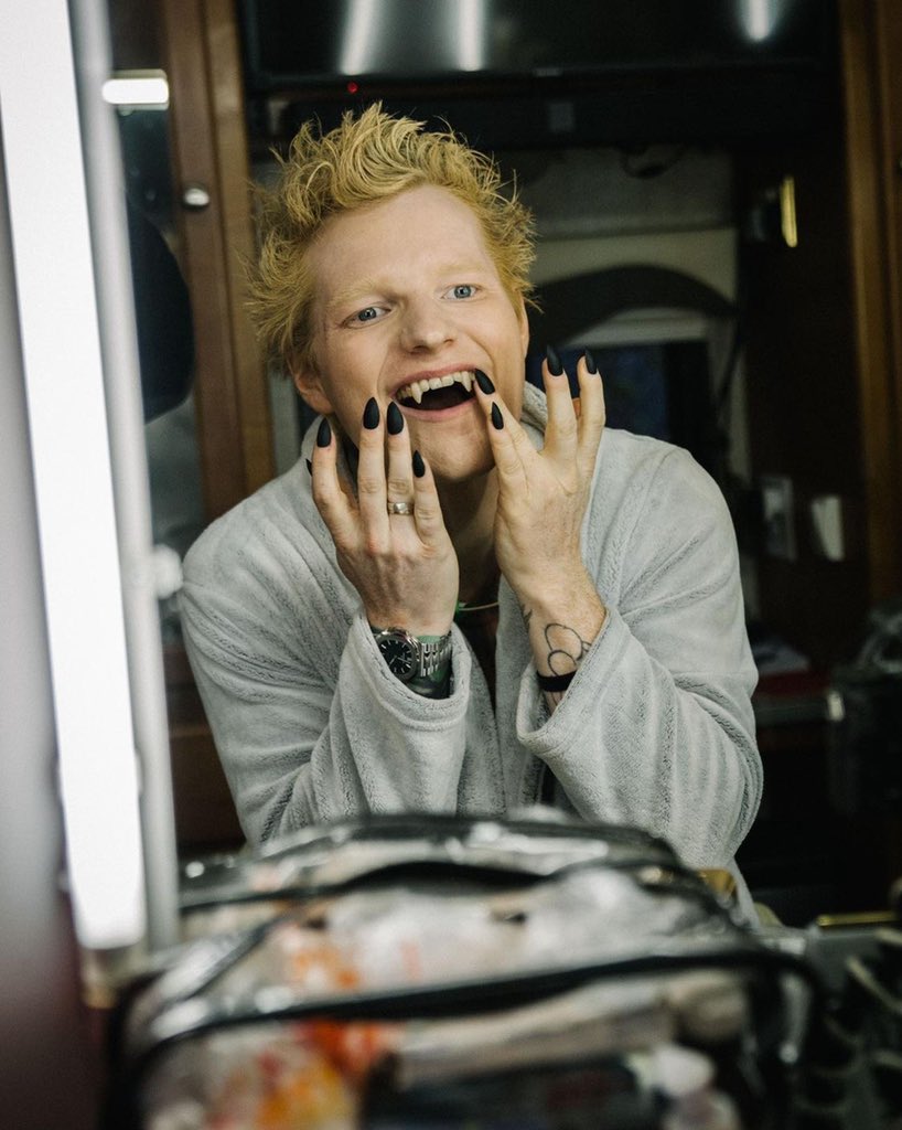 PopCrave's tweet photo. Ed Sheeran shares new photo and reveals his first solo single in 4 years is coming out in a few weeks:

"The nails were a nightmare to try and take a piss with. Wouldn’t recommend" https://t.co/ehkOf4nayJ